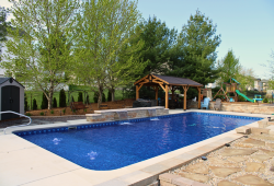 Rectangle lap pool with shallow sun ledge bubblers, deep bench and sheer descent water feature